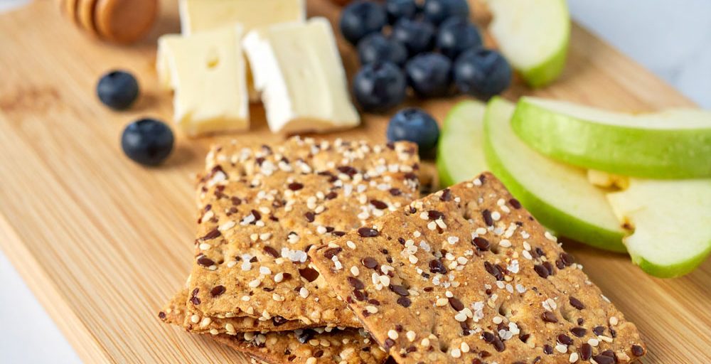Firefly-A-refined-gourmet-snack-board-featuring-square-artisanal-crackers-made-with-mixed-seeds-and--(1)